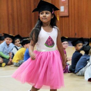 Kindergartner walking at graduation