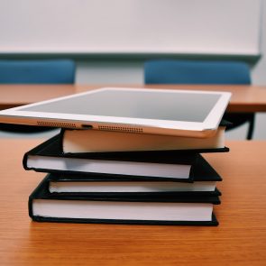 Tablet on stack of books
